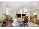 Open living area with an office space, living room, and view to a bedroom at 1509 Burning Lantern Ln, Kannapolis, NC 28081