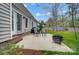 A backyard patio with outdoor seating, grill, and fire pit, perfect for entertaining guests at 1509 Burning Lantern Ln, Kannapolis, NC 28081