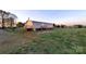 A backyard featuring a wooden deck, lush lawn, and mature trees at 1524 J Rhyne Reep Rd, Vale, NC 28168