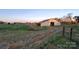 An outside view of a barn with a large door in the side of the structure at 1524 J Rhyne Reep Rd, Vale, NC 28168