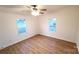 Spacious bedroom with hardwood floors and natural light from two windows, a cozy retreat at 1524 J Rhyne Reep Rd, Vale, NC 28168