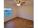 A light-filled bedroom features a window and wood-look flooring at 1524 J Rhyne Reep Rd, Vale, NC 28168