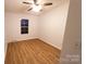 Cozy bedroom with hardwood floors and natural light from a window at 1524 J Rhyne Reep Rd, Vale, NC 28168