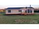 Charming home featuring neutral siding, a dark roof, and a quaint wooden porch at 1524 J Rhyne Reep Rd, Vale, NC 28168