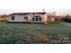 Charming single-story home with a well-maintained lawn, wooden porch, and classic black shutters at 1524 J Rhyne Reep Rd, Vale, NC 28168