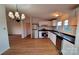 Bright, modern kitchen featuring stainless steel appliances, white cabinets, and wood-look flooring at 1524 J Rhyne Reep Rd, Vale, NC 28168
