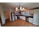 Bright kitchen with stainless steel appliances, white cabinets, black countertops, and wood-look flooring at 1524 J Rhyne Reep Rd, Vale, NC 28168