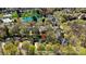Aerial view of the neighborhood with mature trees, pond, and showing the location of this charming home at 16123 Chiltern Ln, Huntersville, NC 28078