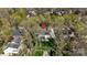 Aerial shot of the house showcases the large yard, screened in porch, and mature tree coverage at 16123 Chiltern Ln, Huntersville, NC 28078