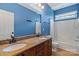 Bathroom with double sink vanity, granite counters, and a separate toilet and shower/tub area at 16123 Chiltern Ln, Huntersville, NC 28078