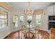 Cozy dining area with hardwood floors, natural light, and access to the outdoor patio at 16123 Chiltern Ln, Huntersville, NC 28078
