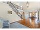 Grand foyer with high ceilings, hardwood floors, and an elegant staircase at 16123 Chiltern Ln, Huntersville, NC 28078