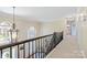 Second floor hallway with a view of the foyer at 16123 Chiltern Ln, Huntersville, NC 28078