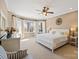 Spacious main bedroom with plush carpet, large windows, and a ceiling fan at 16123 Chiltern Ln, Huntersville, NC 28078