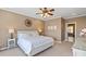 Bright main bedroom featuring a large bed, side tables, and a ceiling fan at 16123 Chiltern Ln, Huntersville, NC 28078