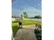 Spacious backyard with lush green lawn, perfect for outdoor activities and relaxation, with partial patio at 16306 Hayfield Rd, Charlotte, NC 28213