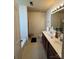 Bathroom featuring a double-sink vanity, bathtub, and shower with white cabinets at 16306 Hayfield Rd, Charlotte, NC 28213