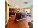 Kitchen with wood floors, cherry cabinets, an island with seating, and stainless appliances at 16306 Hayfield Rd, Charlotte, NC 28213