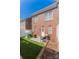 Private backyard featuring artificial turf, a patio area, and a white fence, perfect for outdoor enjoyment at 165 Singleton Rd, Mooresville, NC 28117