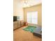 Bedroom featuring neutral decor, plush carpeting, and a window providing natural light; a serene and comfortable space at 165 Singleton Rd, Mooresville, NC 28117