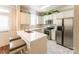 Modern kitchen with white countertops, stainless steel appliances, and marble floors, offering ample countertop space at 165 Singleton Rd, Mooresville, NC 28117