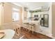 Bright kitchen with white cabinets, stainless steel appliances, and stylish marble floors, offers lots of natural light at 165 Singleton Rd, Mooresville, NC 28117