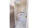 Bright laundry room featuring updated appliances and a utility rack, with light, modern faux-marble flooring at 165 Singleton Rd, Mooresville, NC 28117