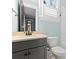 Contemporary bathroom with modern vanity, and an elegant mirror at 18420 Rosapenny Rd, Charlotte, NC 28278