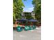 Stunning exterior view of home and private beach featuring Adirondack chairs and umbrellas at 18420 Rosapenny Rd, Charlotte, NC 28278