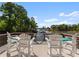 Spacious deck with Adirondack chairs offering panoramic views of the lake at 18420 Rosapenny Rd, Charlotte, NC 28278