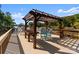 Expansive deck with pergola and outdoor seating, perfect for enjoying the serene lake views at 18420 Rosapenny Rd, Charlotte, NC 28278