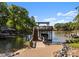 Private dock with boat lift and sundeck, offering convenient lake access and waterfront enjoyment at 18420 Rosapenny Rd, Charlotte, NC 28278