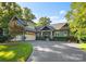 Charming home exterior with large driveway and well-manicured lawn at 18420 Rosapenny Rd, Charlotte, NC 28278