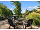 Outdoor brick patio featuring a stone firepit with chairs, perfect for entertaining lakeside at 18420 Rosapenny Rd, Charlotte, NC 28278