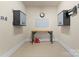 Well-organized garage with storage cabinets, utility sink, and epoxy flooring for a clean workspace at 18420 Rosapenny Rd, Charlotte, NC 28278