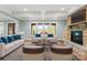 Inviting living room with fireplace, recessed lights, and comfortable seating arrangement at 18420 Rosapenny Rd, Charlotte, NC 28278