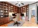 Private office space with custom wood built-in shelving and desk space at 18420 Rosapenny Rd, Charlotte, NC 28278