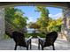 Outdoor seating area with lake views, stairs, and landscaping, providing a tranquil space to enjoy the outdoors at 18420 Rosapenny Rd, Charlotte, NC 28278