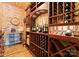 Elegant wine cellar boasting custom wood shelving and extensive bottle storage at 18420 Rosapenny Rd, Charlotte, NC 28278