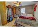 Comfortable bedroom featuring a cozy bed, neutral colors, and efficient ceiling fan at 2114 Whitworth Rd, Cherryville, NC 28021