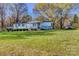 Single story home with manicured lawn, mature trees and an accessible ramp at 2114 Whitworth Rd, Cherryville, NC 28021