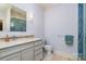 Bright bathroom with vanity, sink, tile accents, and shower with glass door at 2120 Malvern Rd, Charlotte, NC 28207