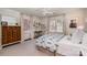 Bright bedroom featuring hardwood floors, multiple windows, and tasteful decor at 2120 Malvern Rd, Charlotte, NC 28207