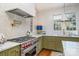 Stylish kitchen featuring custom cabinets, marble countertops, and a stainless steel range at 2120 Malvern Rd, Charlotte, NC 28207