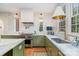 Well-appointed kitchen with marble countertops, custom cabinets, and brass fixtures at 2120 Malvern Rd, Charlotte, NC 28207