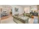 Open-concept living room with archways, fireplace, hardwood floors, and elegant furnishings at 2120 Malvern Rd, Charlotte, NC 28207