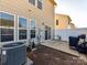 Exterior view of a home featuring a backyard with a patio, fence, and well-maintained lawn at 2240 Kensington Station Pkwy, Charlotte, NC 28210