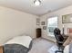 A quaint bedroom featuring natural light, a comfortable beanbag chair, and a built-in desk at 2240 Kensington Station Pkwy, Charlotte, NC 28210