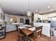 Open floor plan showcasing the dining room, living room, and kitchen at 2240 Kensington Station Pkwy, Charlotte, NC 28210
