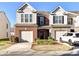 Charming two-story home features a well-maintained front yard and two-car garage at 2240 Kensington Station Pkwy, Charlotte, NC 28210